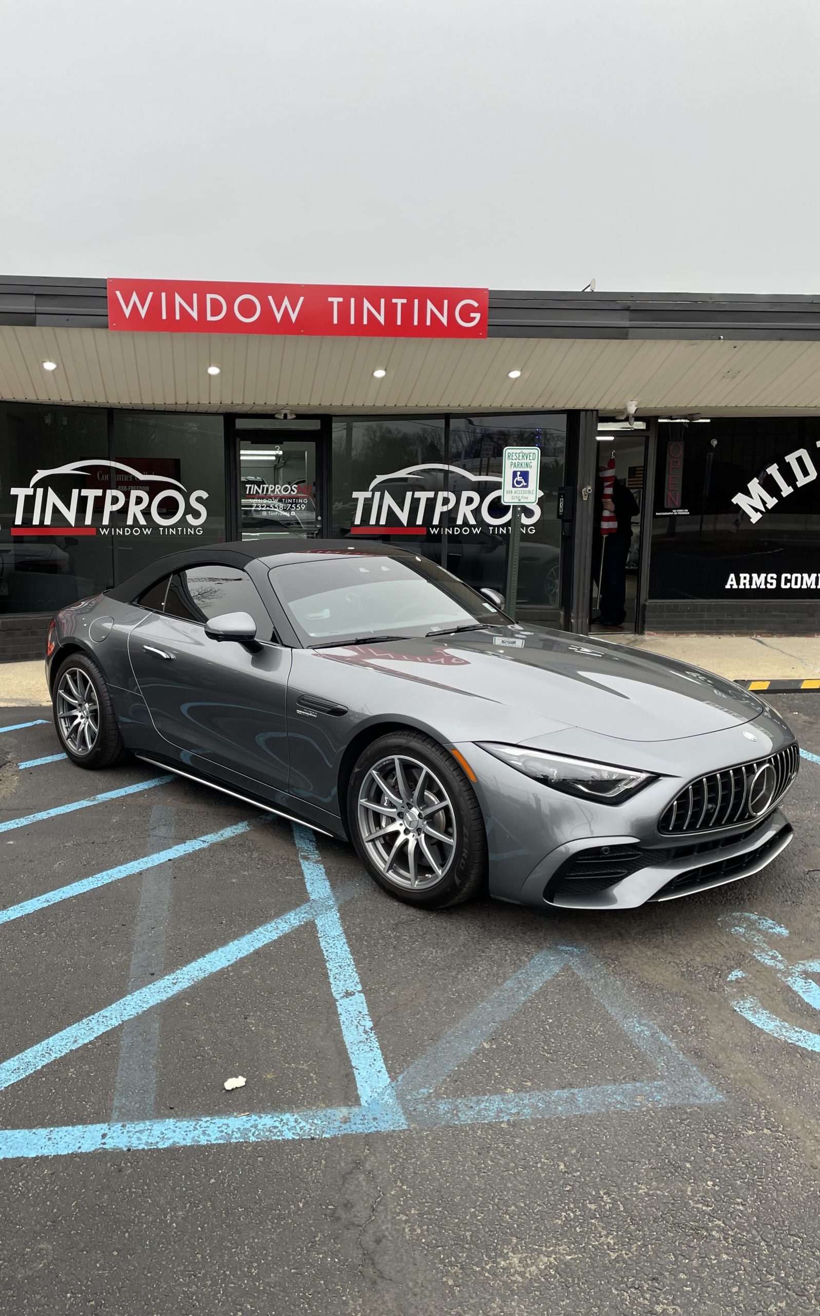 Gray Mercedes AMG convertible with window tinting parked outside TintProsNJ in Port Monmouth NJ